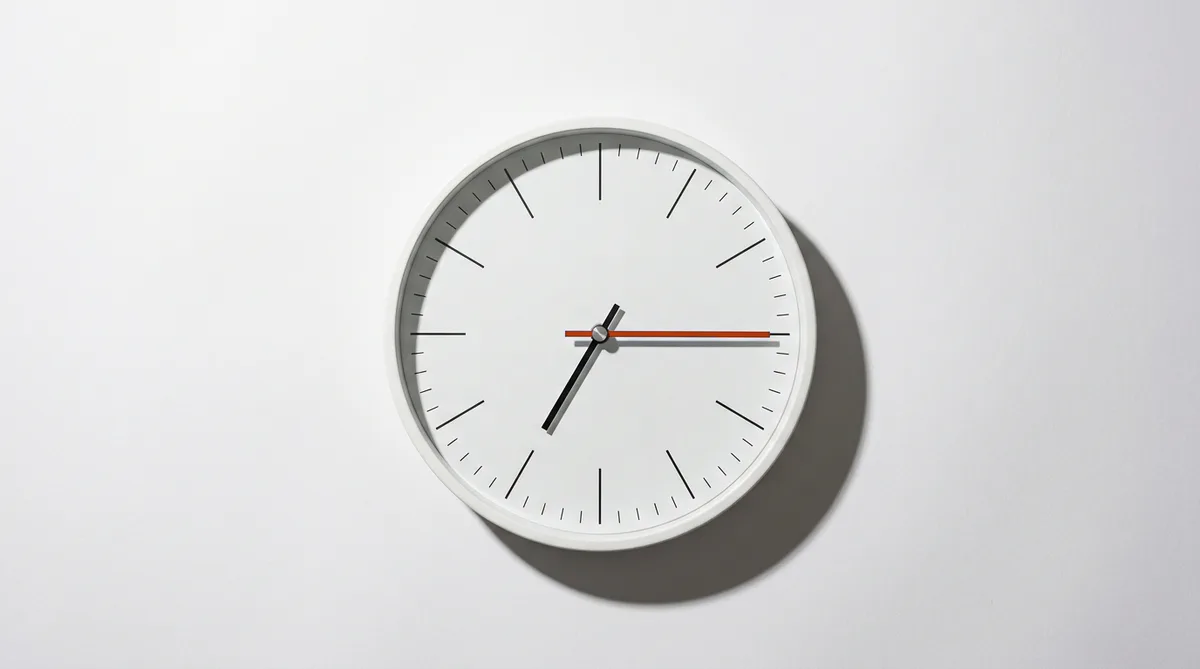 A wall clock reading just past six